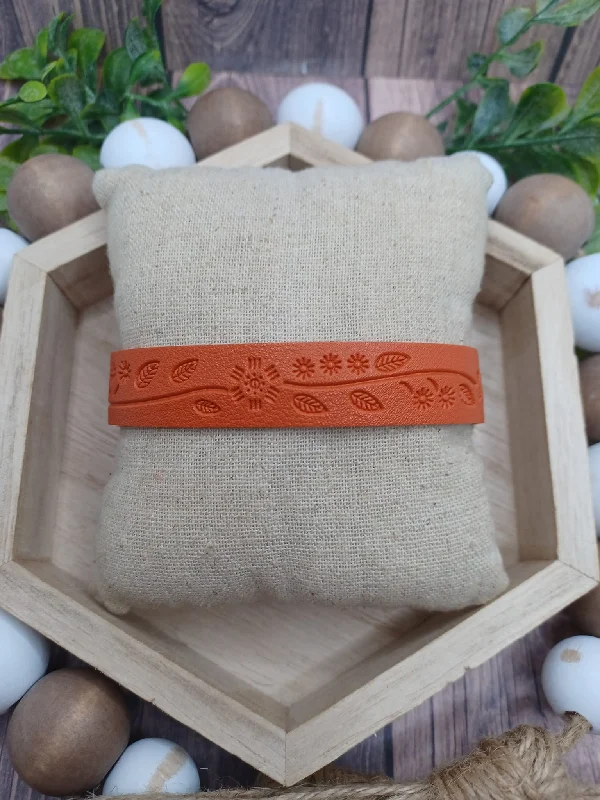 women engraved bracelets -Orange Snap Style Bracelet w/ Floral Embossed Design