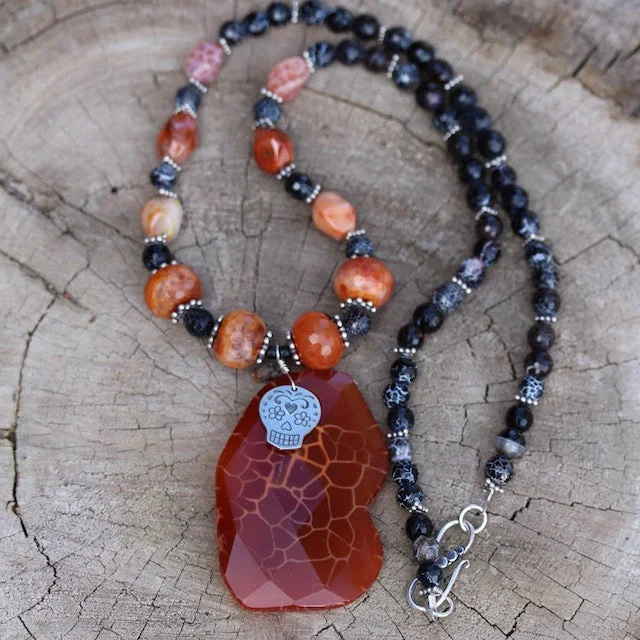 women artistic pendant necklaces -Red agate stone pendant necklace with a sugar skull charm